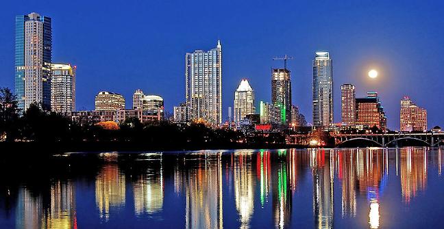 Night view of Austin skyline and Lady Bird Lake as seen from Lou Neff Point. Picture by LoneStarMike 29/03/2010. Licensed under the Creative Commons Attribution 3.0 Unported license.